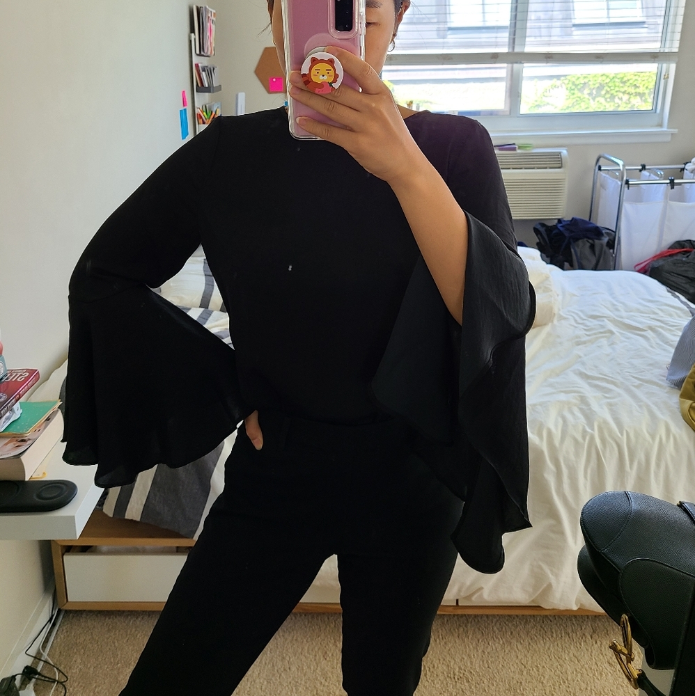 Bell sleeved black top by Whowhatwear